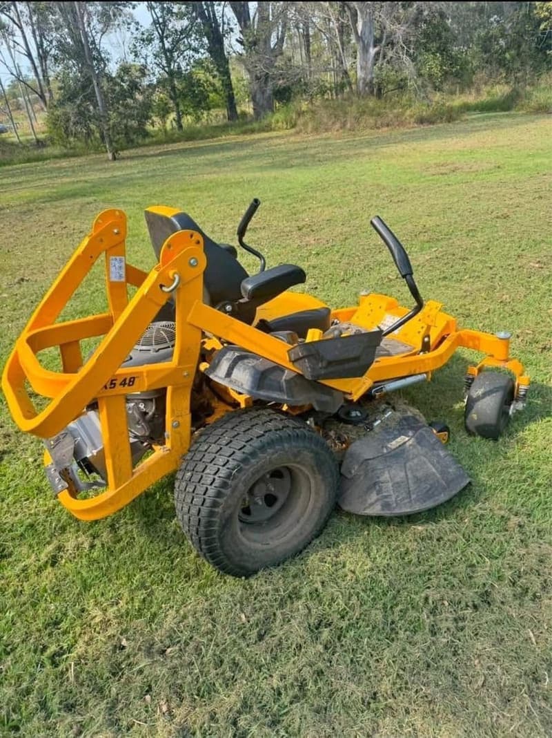 Yellow zero-turn ride-on mower on a lawn